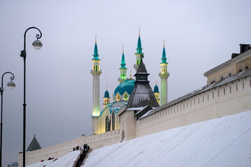 Kazan, cityscape. Wall and towers of the Kazan Kremlin and Kul Sharif Mosque on a cloudy winter day. Tatarstan, Russia