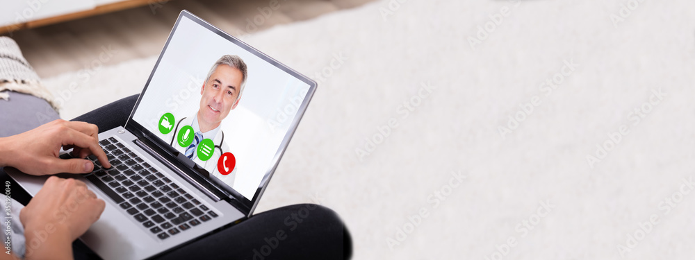 Man Video Conferencing With Doctor On Laptop - obrazy, fototapety, plakaty 