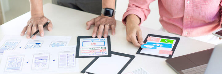 Team User experience (UX) designer creative graphic planning or designing application development a prototype for mobile phone or smartphone layout.