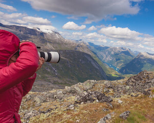 Wall Mural - Tourist taking photo from Dalsnibba viewpoint Norway