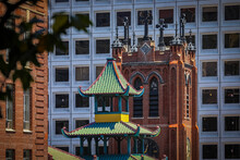 Modern buildings, historic Chinese pagoda and tower of Old Saint Mary's Cathedral in Chinatown San Francisco, California