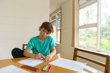 Young boy stuck at home during isolation