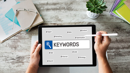 Wall Mural - Keywords. SEO, Search engine optimization and internet marketing concept on screen.