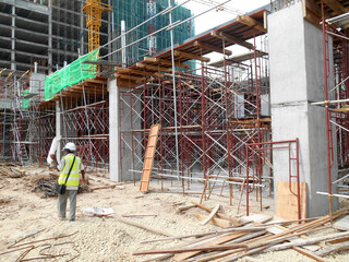 Wall Mural - JOHOR, MALAYSIA -JUNE 30, 2016: Scaffolding used as the temporary structure to support platform, form work and structure at the construction site. Also used it as a walking platform for workers. 

