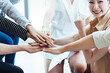 © Shutter B - Teamwork business join hand together concept, Business team standing hands together, Volunteer charity work. People joining for cooperation success business concept.