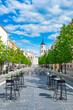 Outdoor bar and restaurant, Vilnius, Lithuania, Europe, to be turned into vast open-air cafe city, reopening after lockdown, empty outdoor tables and chairs in the center of the main street, vertical