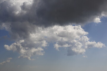 Wall Mural - white fluffy clouds in the blue sky.
