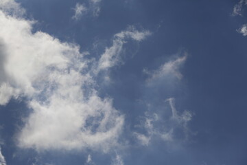 Wall Mural - white fluffy clouds in the blue sky.