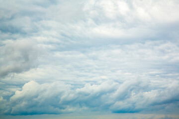 Wall Mural - white fluffy clouds in the blue sky.