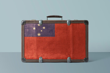 Wall Mural - Samoa flag on old vintage leather suitcase with national concept. Retro brown luggage with copy space text.