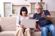 © Elnur - Old couple doing the online shopping
