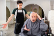 Dissatisfied man with shaved head in barbershop