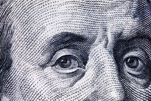 Macro Close Up Of Ben Franklin's Face On The US $100 Dollar Bill.