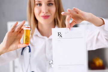 Wall Mural - Female doctor hands hold prescription