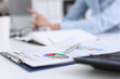 © H_Ko - Financial statistics documents on clipboard pad