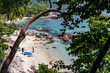 Beautiful tropical beach with white sand, palms and turquoise water on Perhentian Island, Malaysia