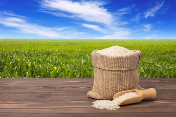 Wall Mural - rice on table against the green field