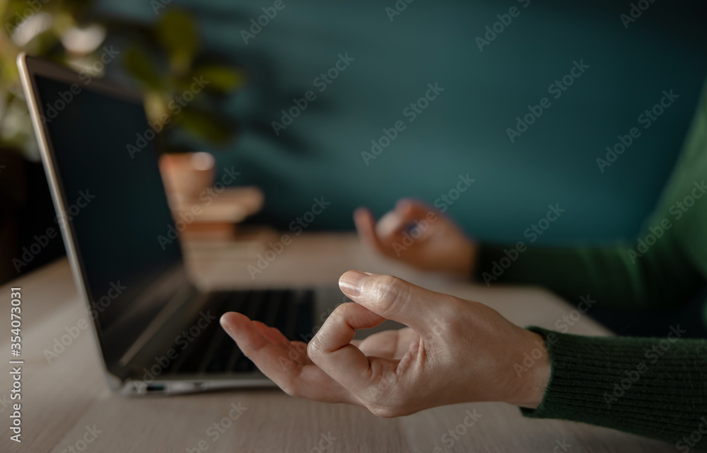 Work Life Balance Concept. Woman sitting on Desk and making the Meditation while Working on Computer Laptop. Mental Health and .Calm thoughtful. Slow Down an Emotion from Stress Work - obrazy, fototapety, plakaty 