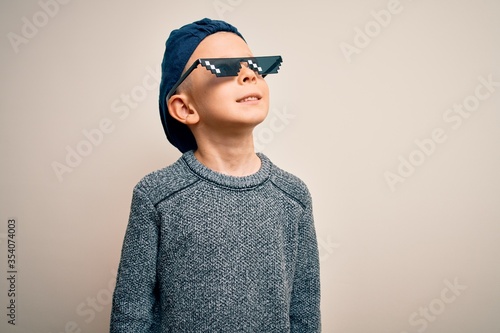 Young Little Caucasian Kid Wearing Internet Meme Thug Life Glasses Over Isolated Background Looking Away To Side With Smile On Face Natural Expression Laughing Confident Buy This Stock Photo And Explore