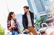 © MDBPIXS - Portrait of young couple walking in the middle of the city