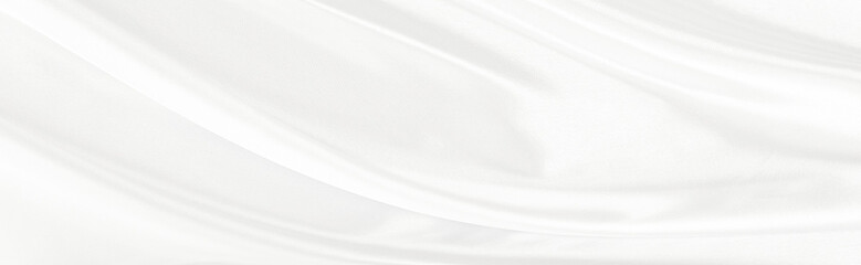 White gray satin texture that is white silver fabric silk panorama background with beautiful soft blur pattern natural.