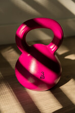 Pink Kettlebell With Dramatic Light
