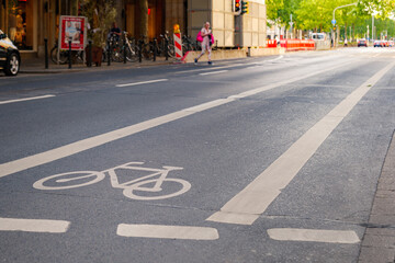 Wall Mural - View of bicycle icon symbol on bicycle lane on the road of downtown in Düsseldorf, Germany. Cycling friendly city in Europe. 