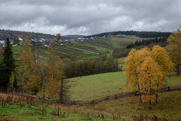 The colors of autumn. Golden autumn in the mountains of Bashkortostan. Mountain village.