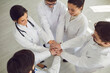 © Studio Romantic - Group of doctors joined hands together. Medicine healthcare clinic hospital concept .