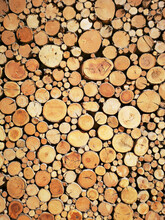Sawn Timber Logs Stacked For A Wood Burning Stove. Close Up In Full Frame And A Vertical Format.
