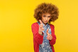 © khosrork - I'll kill you! Portrait of curly-haired hipster woman pointing finger guns to camera, aiming target and threatening to shoot with pistol hand gesture. indoor studio shot isolated on yellow background