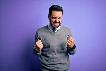 Sticker - Handsome businessman with beard wearing casual tie standing over purple background very happy and excited doing winner gesture with arms raised, smiling and screaming for success. Celebration concept.