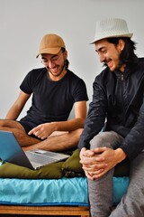 two brothers looking at the computer