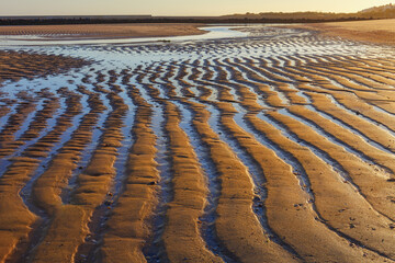 Wall Mural - Sand waves, textures and shapes that occur at low tide