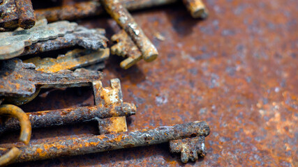 Bunch antique keys on metal table. Close up.