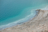 Fototapeta Niebo - landscape of the Dead Sea, failures of the soil, illustrating an environmental catastrophe on the Dead Sea, Israel
