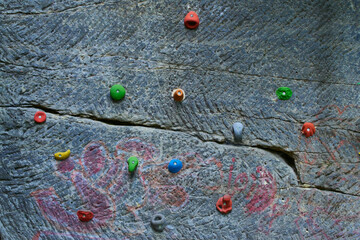 Wall Mural - Child Girl having fun during rock climbing training on boulder wall