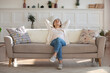 © fizkes - Happy calm young Caucasian woman relax on comfortable modern sofa in living room nap or sleep, relaxed girl rest on couch at home, relive negative emotion, breathe fresh air, stress free concept