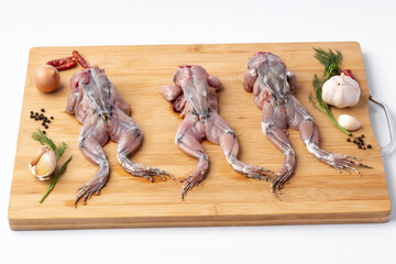 Raw Frogs on white background