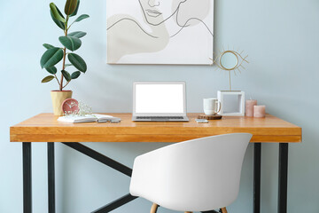 stylish workplace with modern computer in interior of room