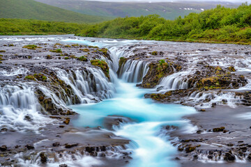 Wall Mural - Bruarfoss Waterfall in the summer, with trees and green grass all over the area. This is a waterfall that is hidden among nature in Iceland.