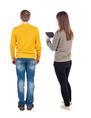 Canvas Print - Back view of couple in sweater with mobile phone.