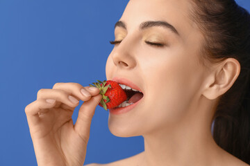 Sticker - Sexy young woman with strawberry on color background