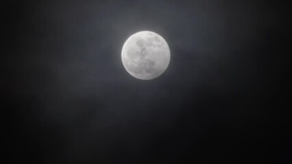 Wall Mural - full moon moving between clouds, 4k