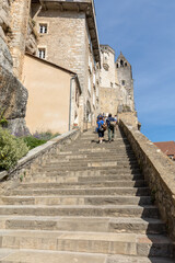 Wall Mural -  People on steep steps Big stairs at Pilgrimage town of Rocamadour, Episcopal city and sanctuary of the Blessed Virgin Mary, Lot, Midi-Pyrenees, France