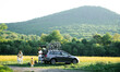 © Halfpoint - Family with two small children and face masks going on cycling trip in countryside.