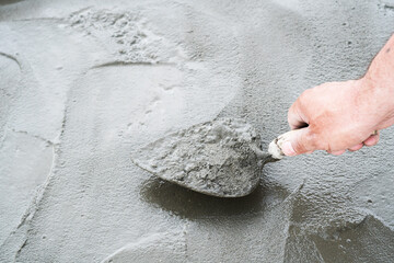 Pouring the track with liquid concrete. Construction works.