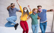 © DisobeyArt - Young people having fun around city street during coronavirus outbreak - Happy friends wearing face protective masks and laughing together - Main focus on girls faces