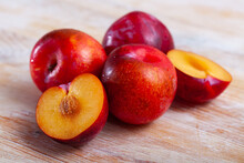 Whole And Halves Red Appetizing Plums