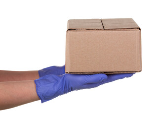 Closeup delivery woman hand in medical gloves holding cardboard box isolated on white background, Delivery service concept.